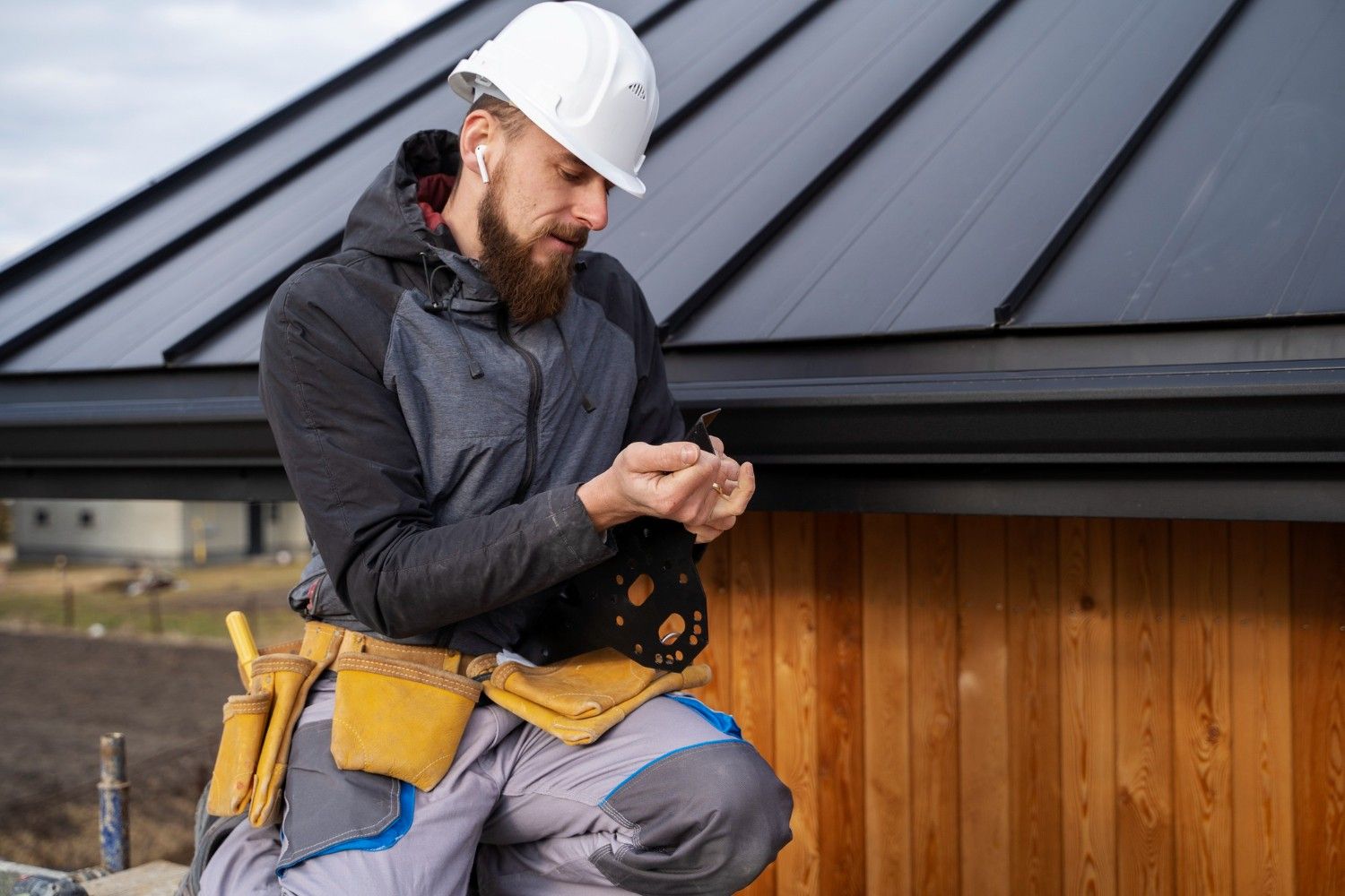 A man wearing a hard hat and work